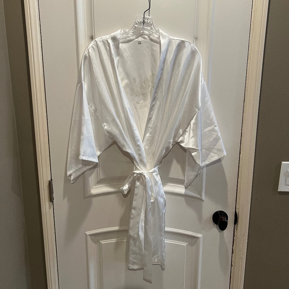 Silky white robe with "Bride" written on the back